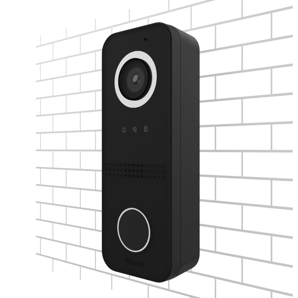 The BAS-IP AV-06 entrance panel, with a camera, illuminated status symbols and call button, mounted on a brick wall.